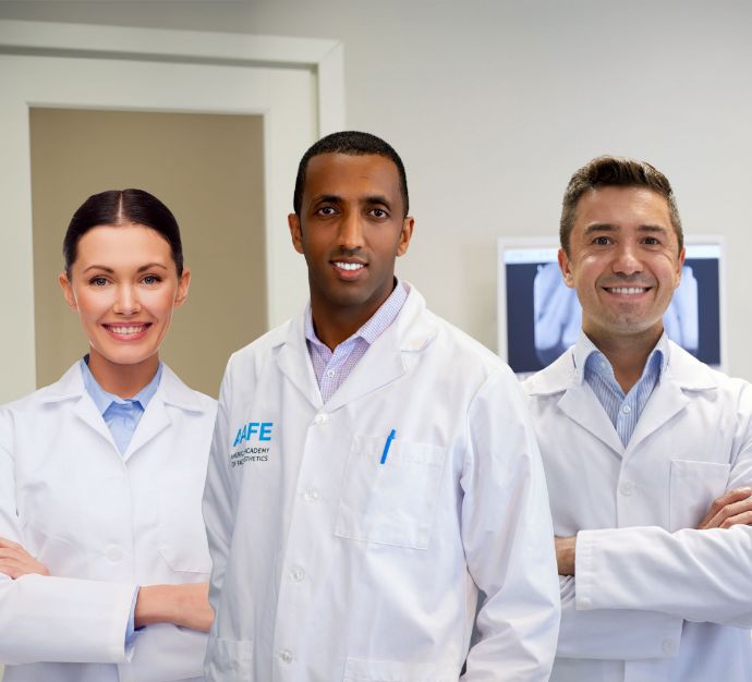 Doctor G smiling with two other dentists