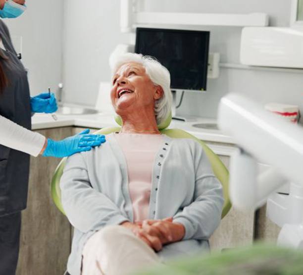 Patient and dentist reviewing X-ray