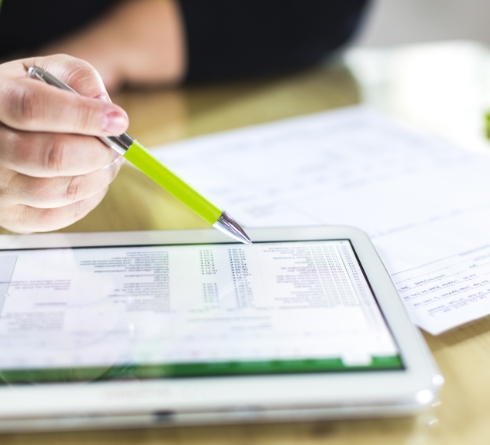 Person looking at dental insurance information on a tablet