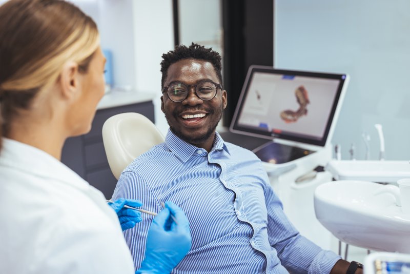 Patient smiling after cosmetic dentistry consultation